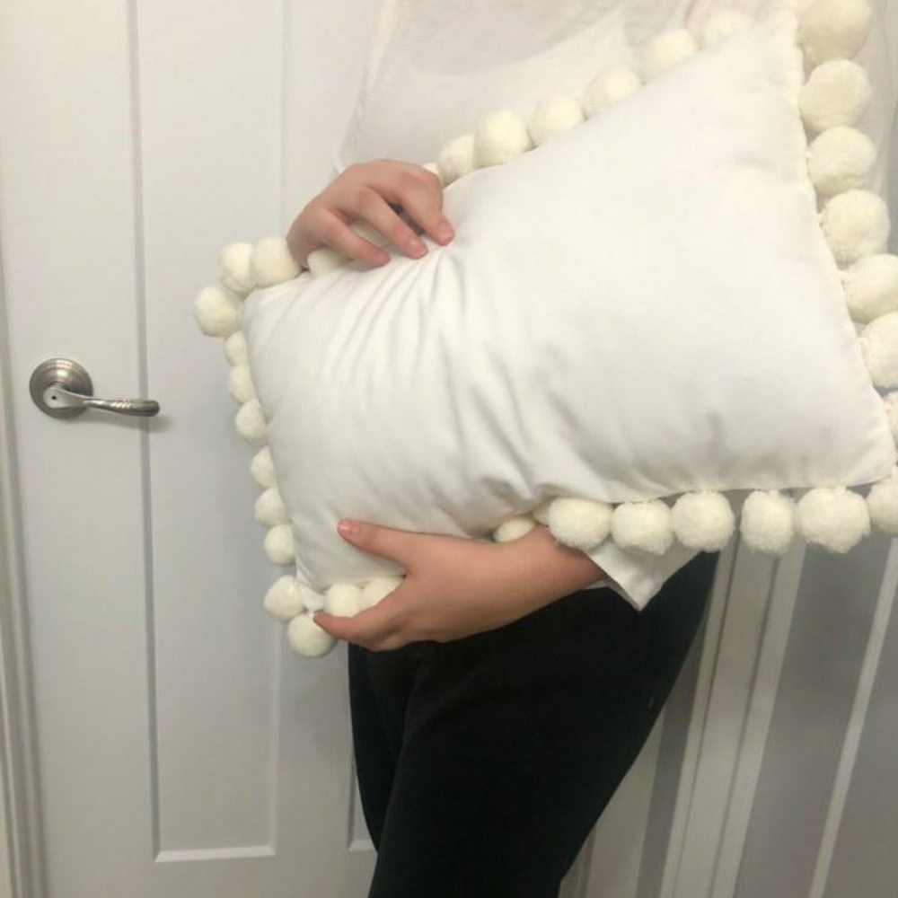White Throw Pillow with PomPom Detailing